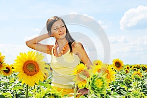Beautiful woman and sunflowers