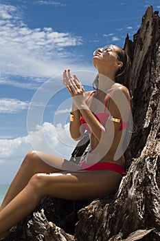 Beautiful woman in sunglasses and red bikini on beach. Fashion look. lady
