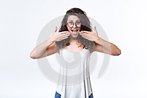 Beautiful woman surprised over white background.