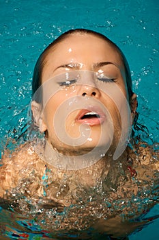 Beautiful woman in a swimming pool.