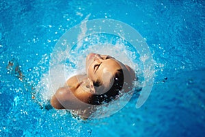 Beautiful woman in a swimming pool