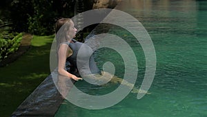 Beautiful Woman Swimming Pool At Resort Relaxed Portrait Young European Girl.