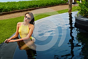 Beautiful Woman In Swimwear Relaxing In Swimming Pool. Summer Vacations