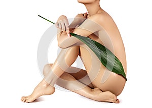 Beautiful woman takes care of body. Spa treatment, healthy skin, perfect slim shapes. Wellness, smooth legs, depilation