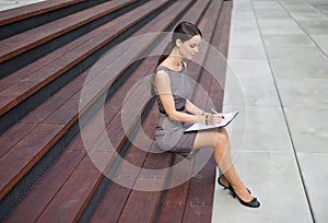 Beautiful Woman Taking Notes