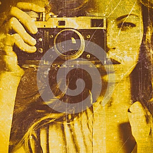 Beautiful woman taking photos with retro film camera