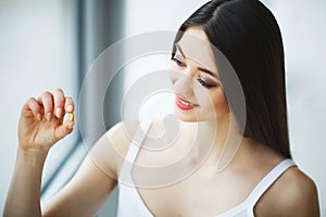 Beautiful Woman Taking Pill, Medicine. Vitamins And Supplements