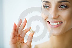 Beautiful Woman Taking Pill, Medicine. Vitamins And Supplements