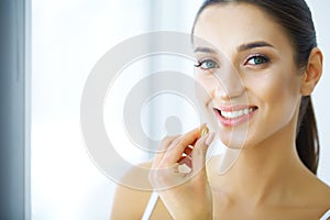 Beautiful Woman Taking Pill, Medicine. Vitamins And Supplements