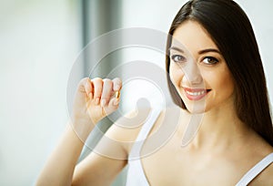 Beautiful Woman Taking Pill, Medicine. Vitamins And Supplements