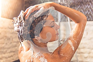 Beautiful woman taking shower