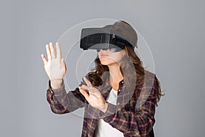 Beautiful woman testing virtual reality helmet