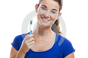 Beautiful woman with a toothbrush