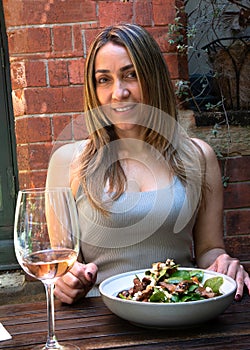 Beautiful woman with a tossed lamb salad