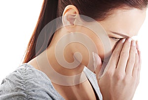 Beautiful woman touching her nose.