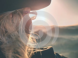 Beautiful woman tourist enjoy daybreak on sharp of rock