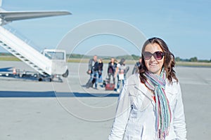 Beautiful woman tourist prepared to fly