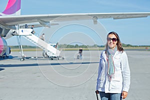 Beautiful woman tourist prepared to fly