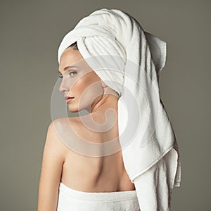 Beautiful woman with towel on her head