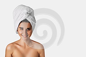 Beautiful woman with a towel on her head. Cosmetology , beauty and spa