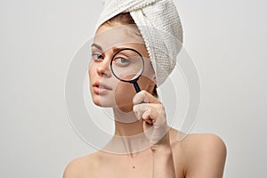 beautiful woman with a towel on my head skin problems close-up