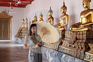 Beautiful woman in traditional dress costume,Asian woman wearing typical Thai dress identity culture of Thailand.