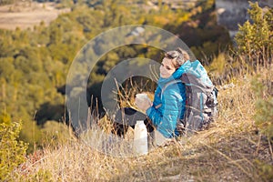 Beautiful woman traveling in autumn mountains