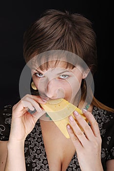 Beautiful woman trys piece of cheese