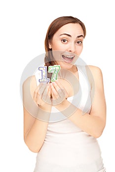 Beautiful woman with two candles on the white