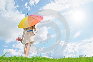 Beautiful woman with umbrella and cloud sky