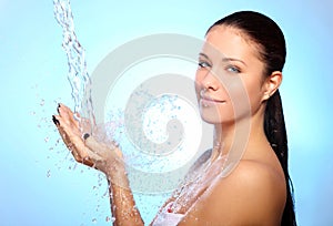 Beautiful woman under splash of water