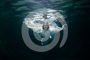 Beautiful woman under the water.