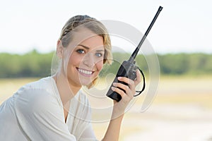 beautiful woman using walkie talkie