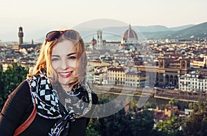 Beautiful woman with view of the city Florence from Piazzale Mic