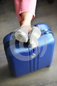 Beautiful woman waiting for delayed or connection flight with luggage in airport