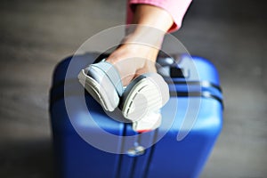 Beautiful woman waiting for delayed or connection flight with luggage in airport