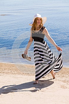 Beautiful woman walking on the beach