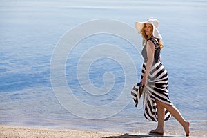Beautiful woman walking on the beach