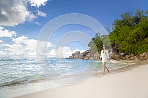 A beautiful woman walking on the beach