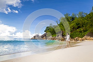 A beautiful woman walking on the beach