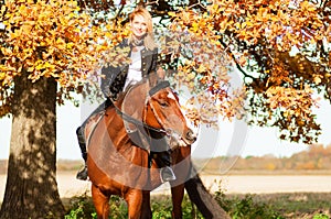 Beautiful woman walking with horse