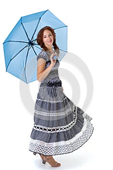 Beautiful woman walking under umbrella