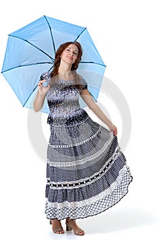 Beautiful woman walking under umbrella