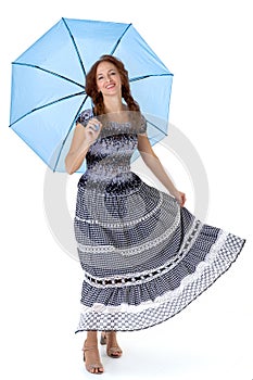 Beautiful woman walking under umbrella