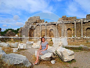 beautiful woman at the walls of ancient city