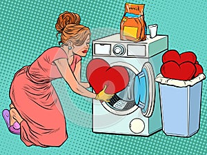 Beautiful woman washes a red heart. Valentines day photo