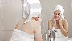 Beautiful woman washing face on faucet