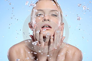 Beautiful woman washing her face