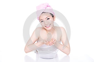 Beautiful woman washing her face