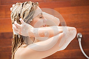 Beautiful woman washing her hair